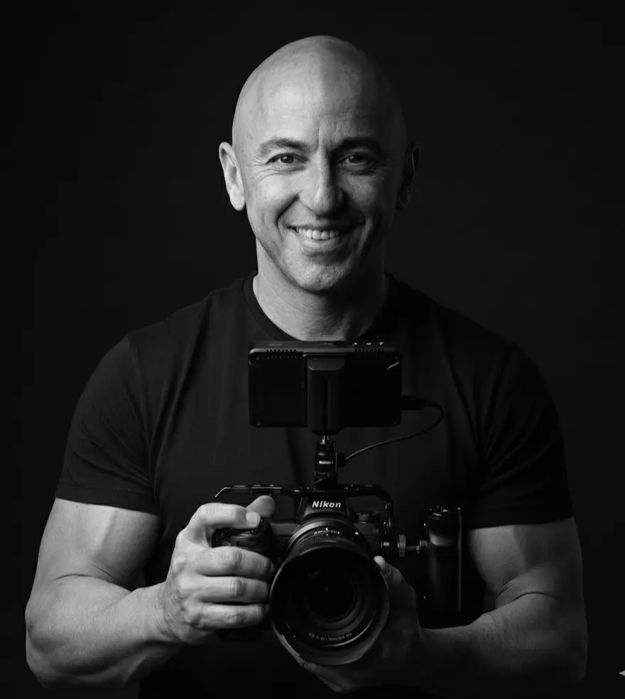 Sandro, founder of MIO Media, holding a Nikon cinema camera